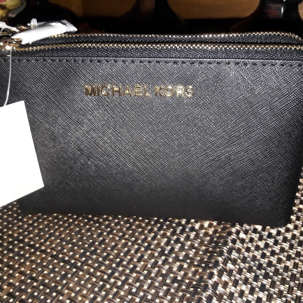 Micheal kors wristlet new with tags $65.00
